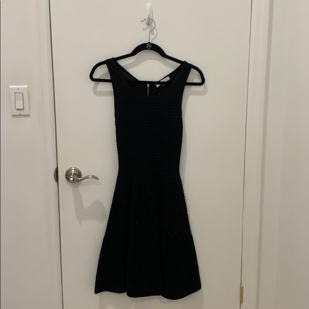 Black sleeveless dress, above knee